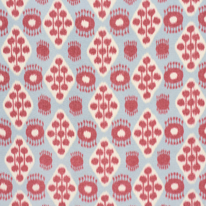 Light blue fabric with white diamond motifs featuring pink tree-branch shapes and pink circular floral accents.