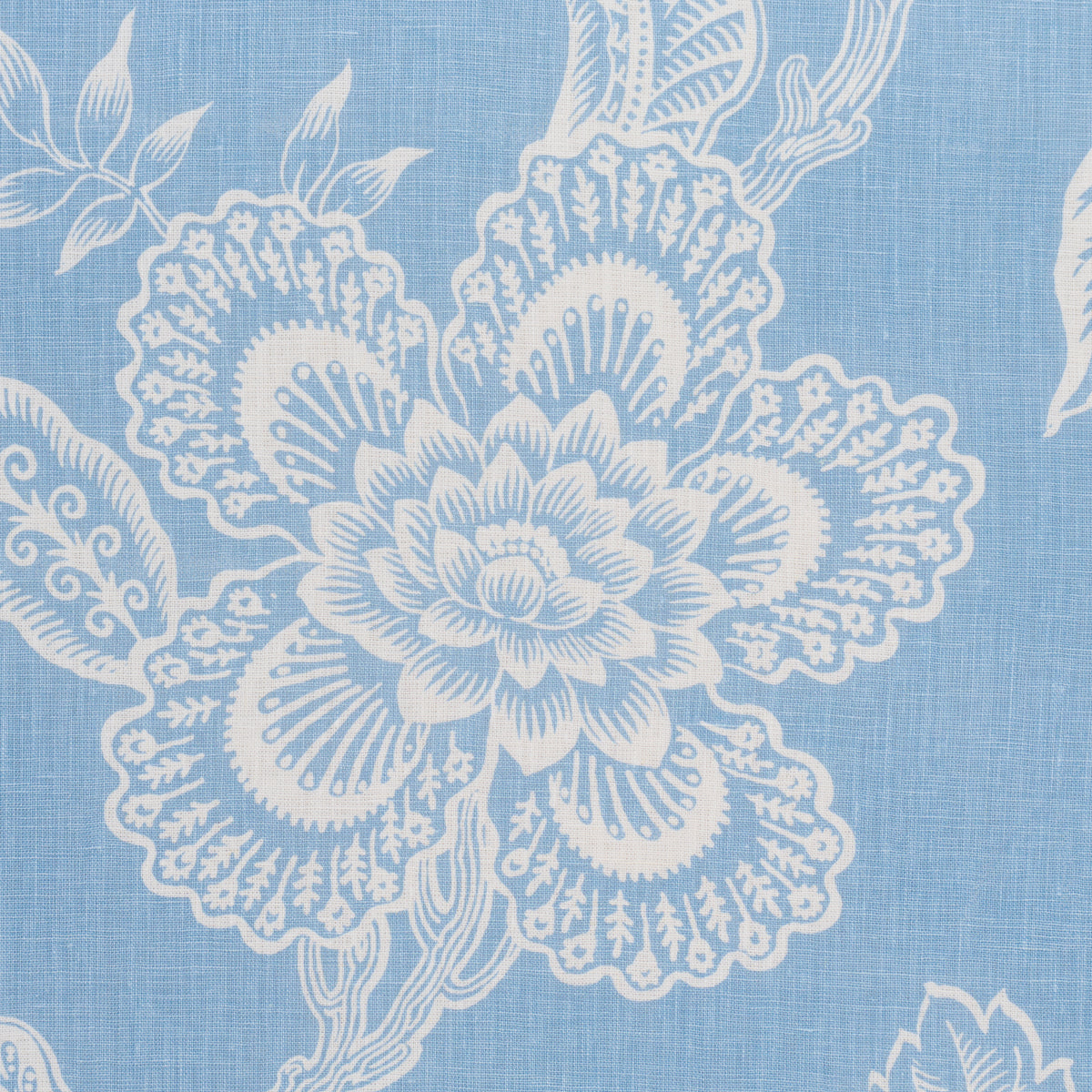 Blue fabric with white intricate floral pattern, featuring a large central bloom and leafy vines.