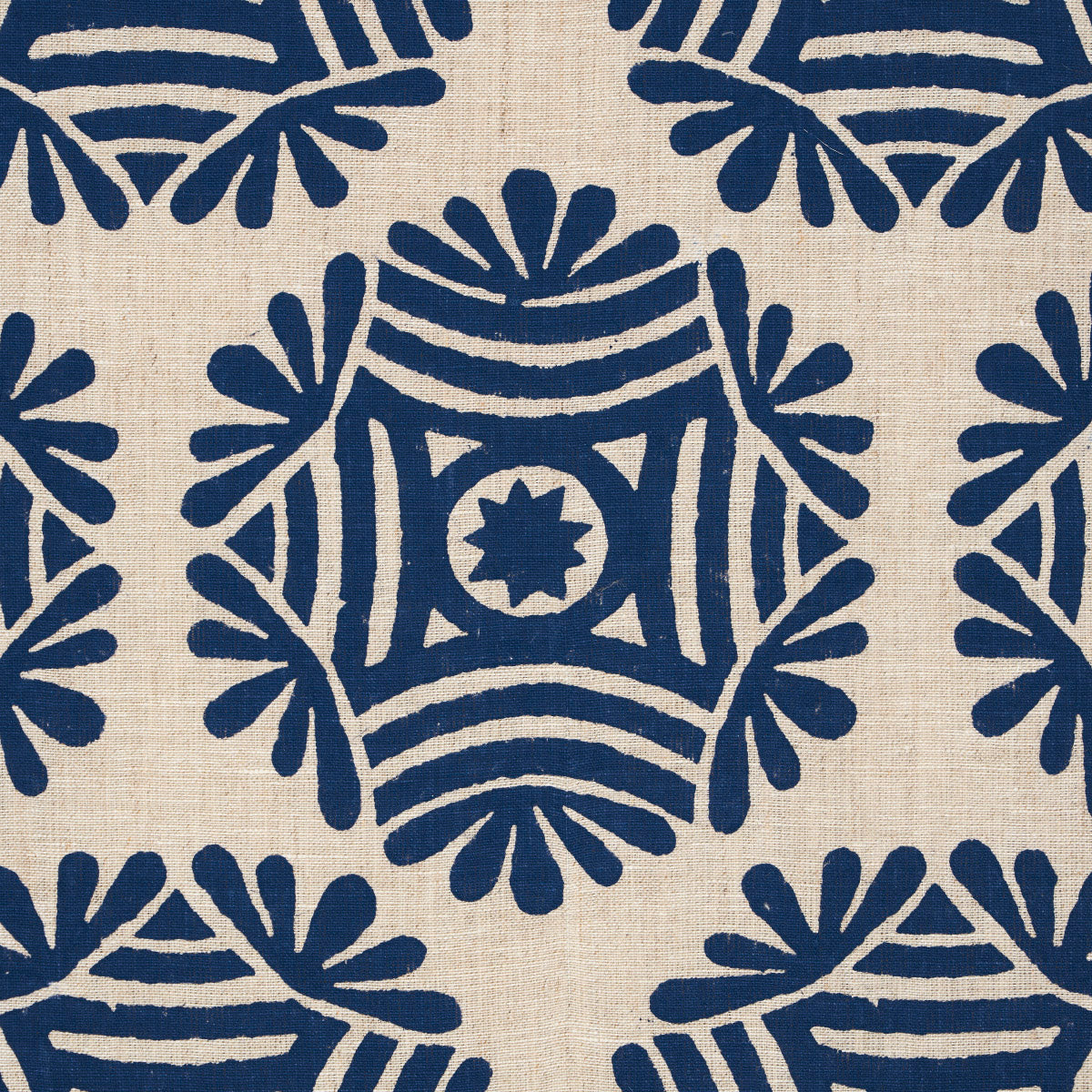 Navy blue geometric floral print on natural linen fabric; square motifs with star center, repeating pattern.