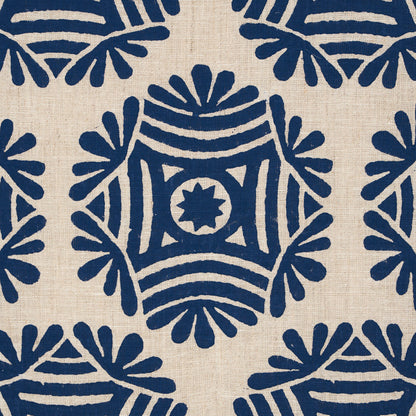 Navy blue geometric floral print on natural linen fabric; square motifs with star center, repeating pattern.
