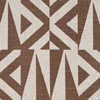 Brown and cream woven fabric with interlocking triangles and diamond shapes in a bold geometric tribal pattern.