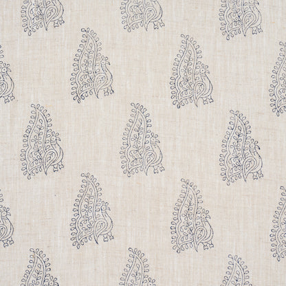 Beige flax linen fabric with repeating dark navy peacock motifs in a hand-blocked boho print.