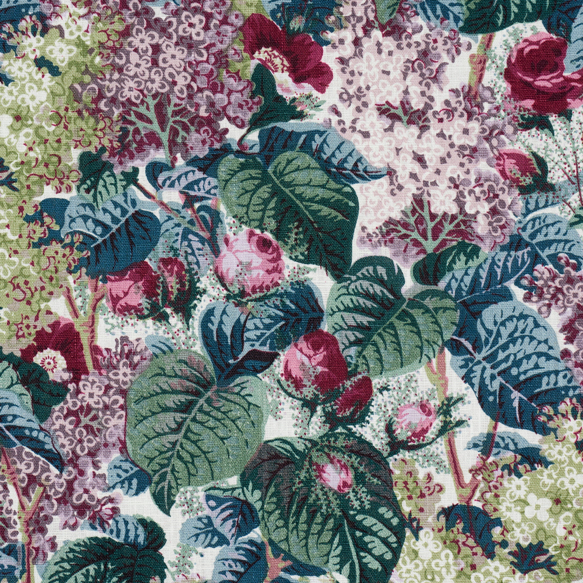 Vibrant botanical fabric print with large green leaves and pink-purple hydrangea clusters; bold floral pattern.