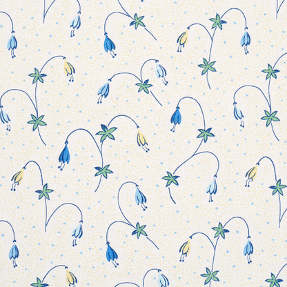 Repeating floral pattern with curved blue stems, blue and yellow bell flowers, green leaves on pale beige dotted background