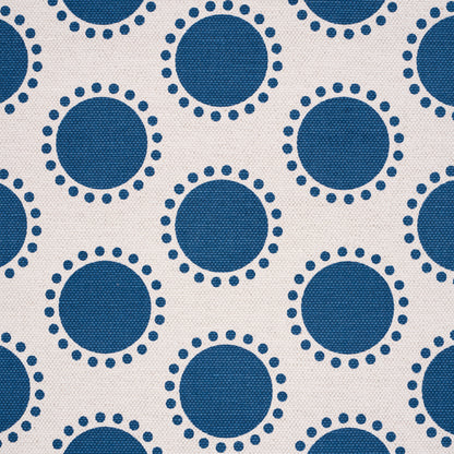 Navy blue circles with dotted rims, repeated on a light fabric background.