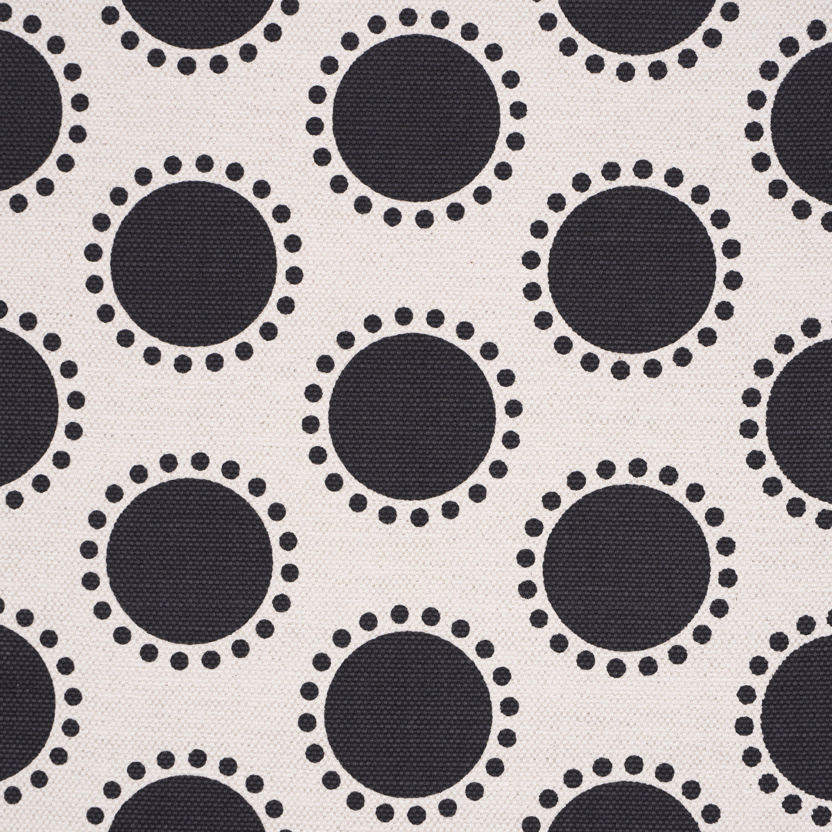 Beige fabric with navy circles surrounded by dotted rings; retro geometric dot pattern.