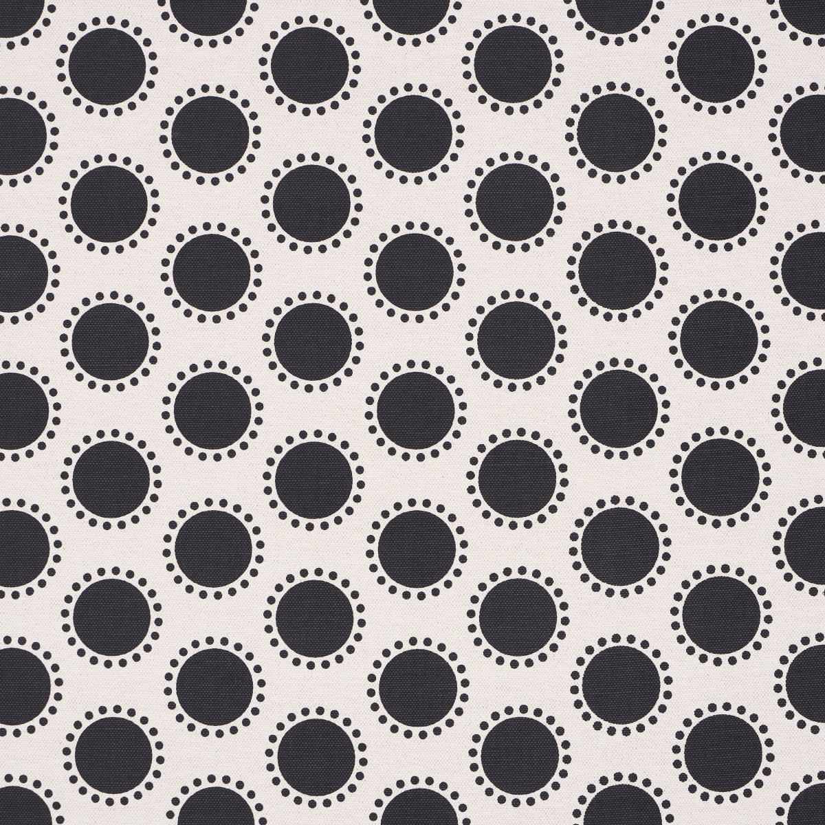 Light fabric with black circles outlined by small white dots in a repeating geometric dot pattern.