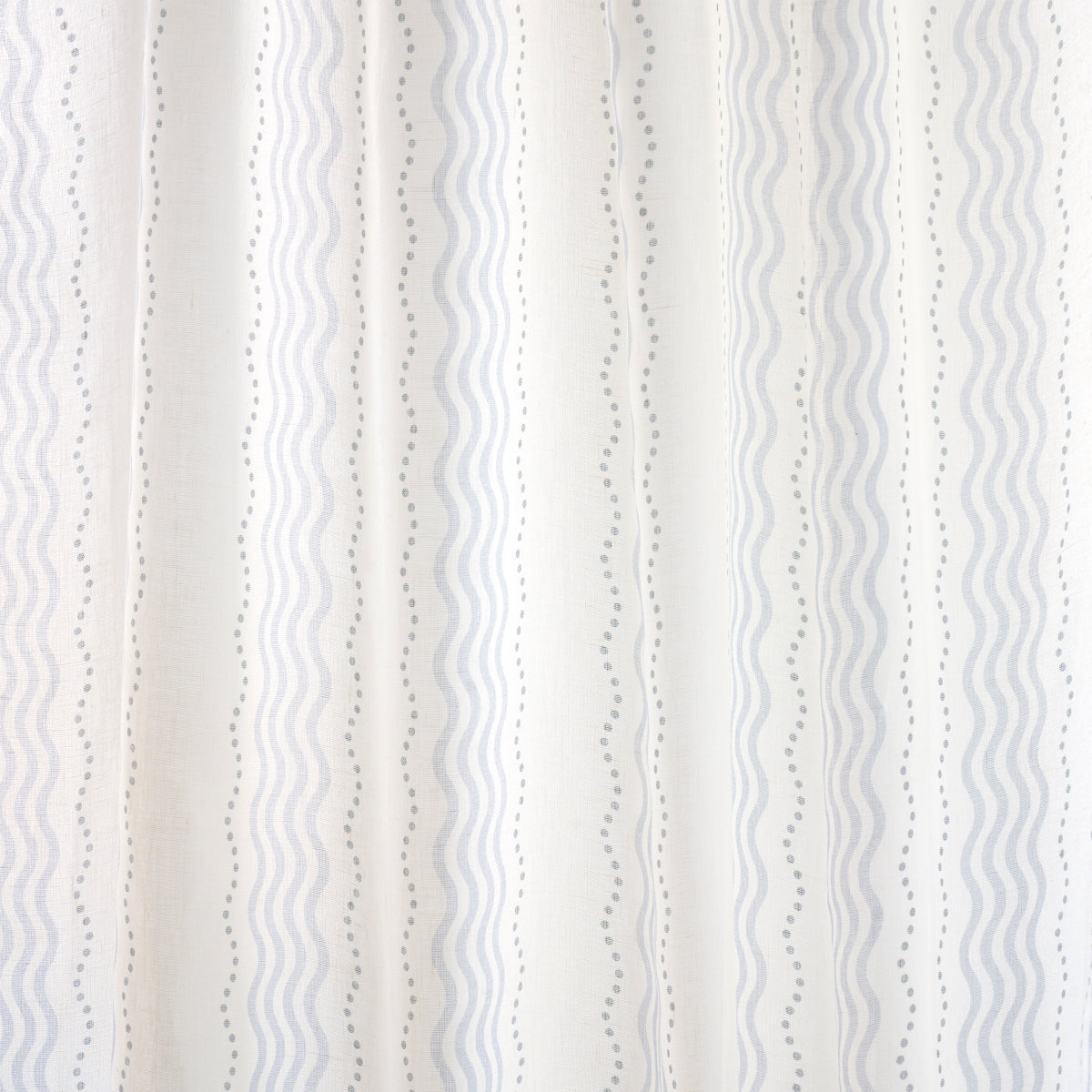 Neutral striped fabric with vertical wavy and dotted lines in beige and pale gray; ideal for curtains or upholstery.