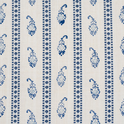 Blue paisley & geometric stripe pattern on cream woven fabric.