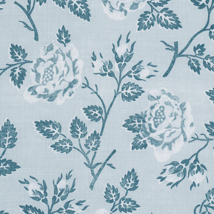 Light blue linen-like fabric with teal floral pattern of roses and leaves, ideal for upholstery or curtains.