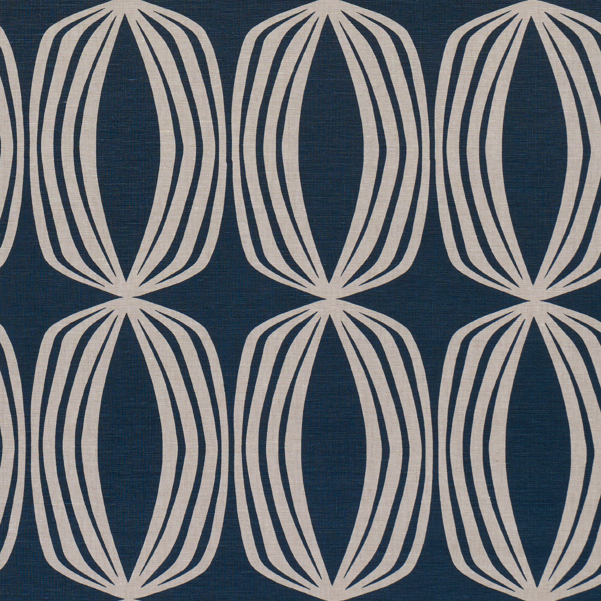 Indigo fabric with repeating cream oval lattice motifs formed by curved lines.