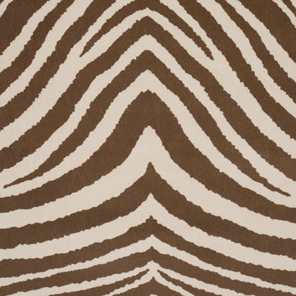 Brown and beige zebra-striped rug with a wavy chevron pattern.