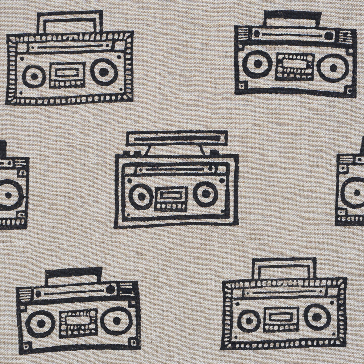 Beige fabric with repeating black line-drawn boombox cassette players; retro graphic pattern.