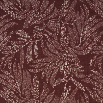 Maroon fabric with pale pink dotted leaf pattern; botanical textile with flowing leaves.