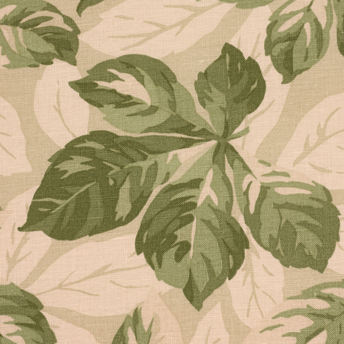 Beige linen-like fabric with large olive green tropical leaf pattern; botanical upholstery textile.