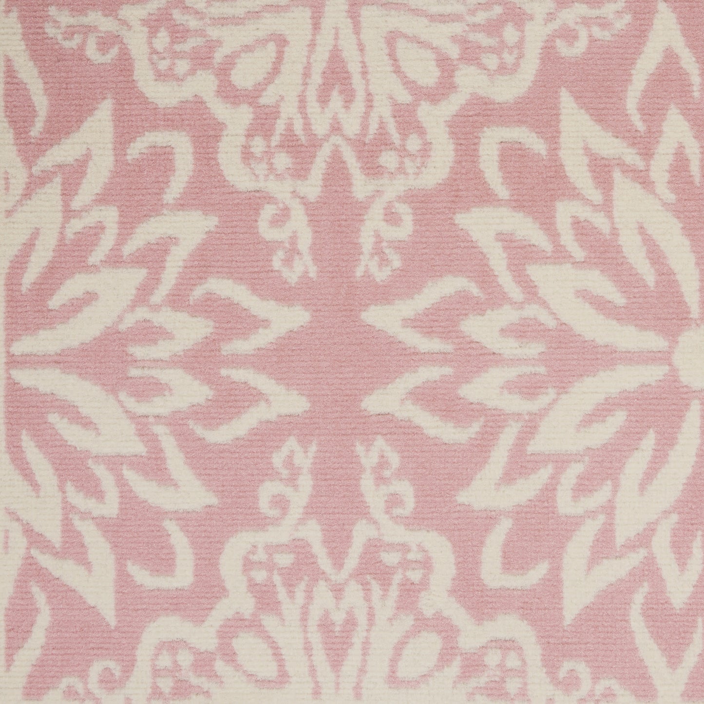 Pink rug with a white damask floral pattern in a jacquard-style design, 3' x 5'.