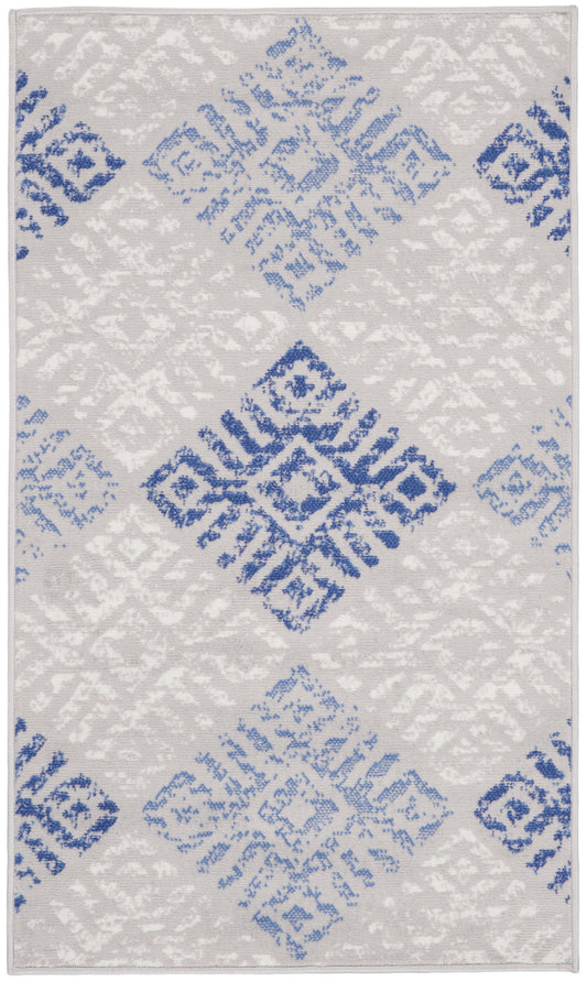 Rectangular area rug with a light gray backdrop and blue geometric diamond motifs in a repeating Bohemian-inspired pattern, 3' x 5'.