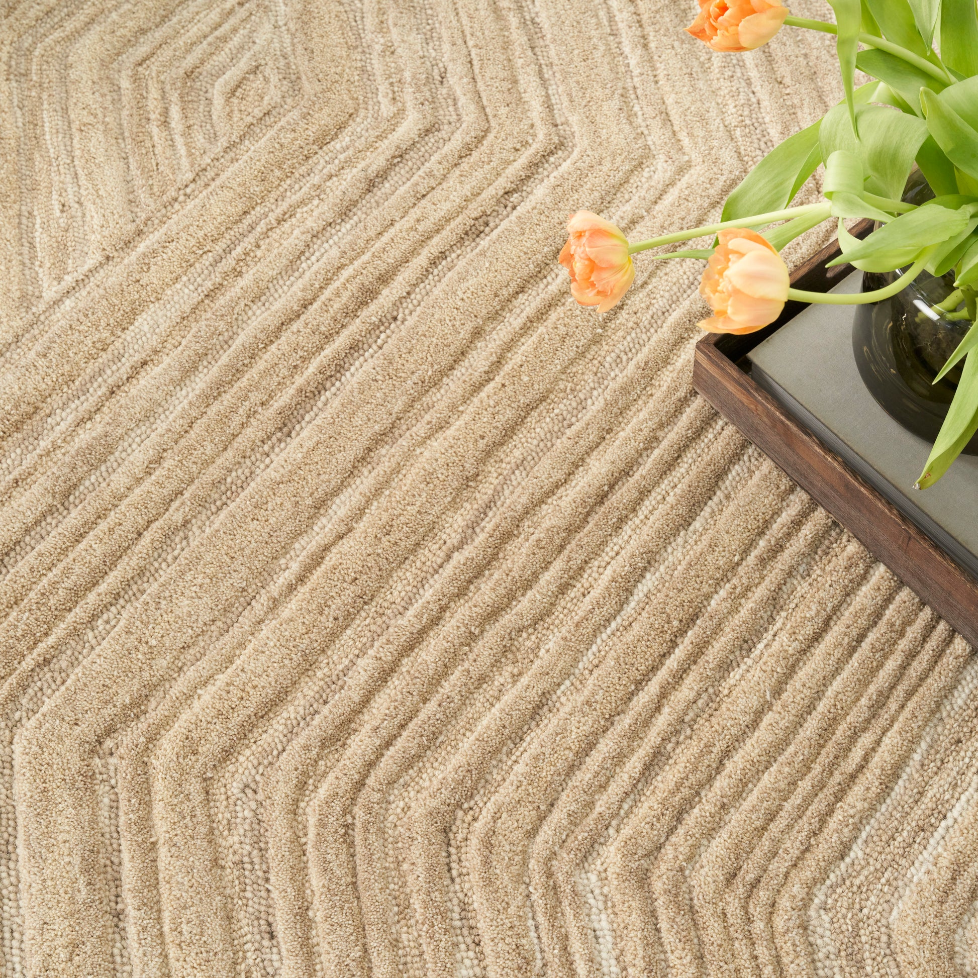 Beige textured rug with chevron grooves, 8' x 10'.