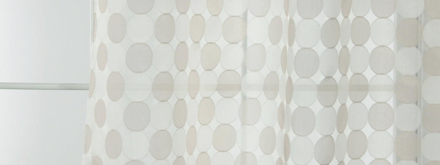 Light sheer curtain panel with large beige and gray polka dots, contemporary window treatment for airy decor.
