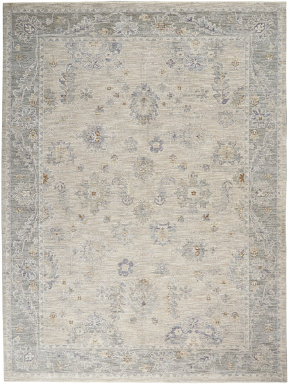 Beige area rug with muted blue-gray border and lilac floral accents in a vintage Persian-inspired pattern.