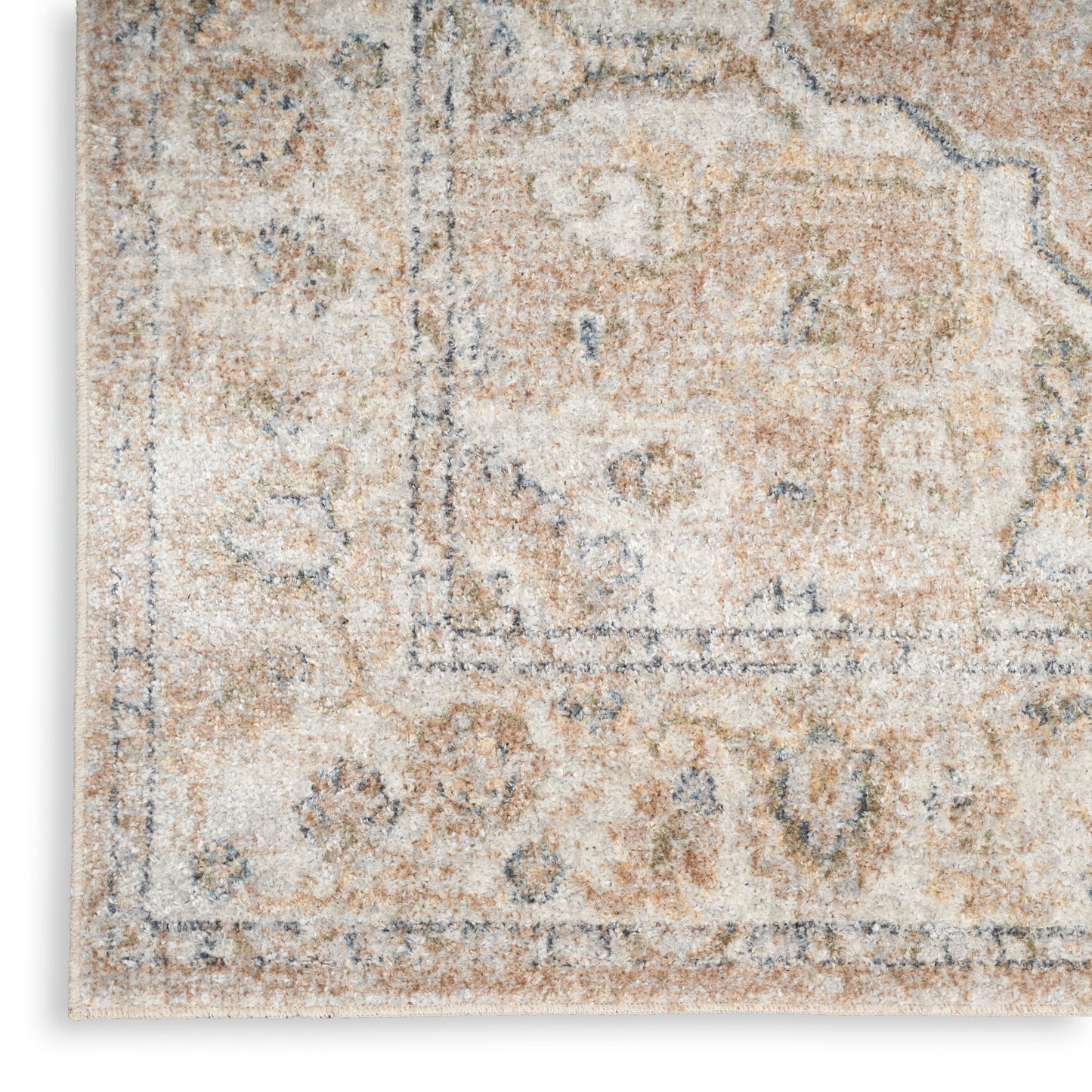 Distressed cream and beige area rug with muted blue-gray motifs; vintage Persian-inspired design, soft pile.
