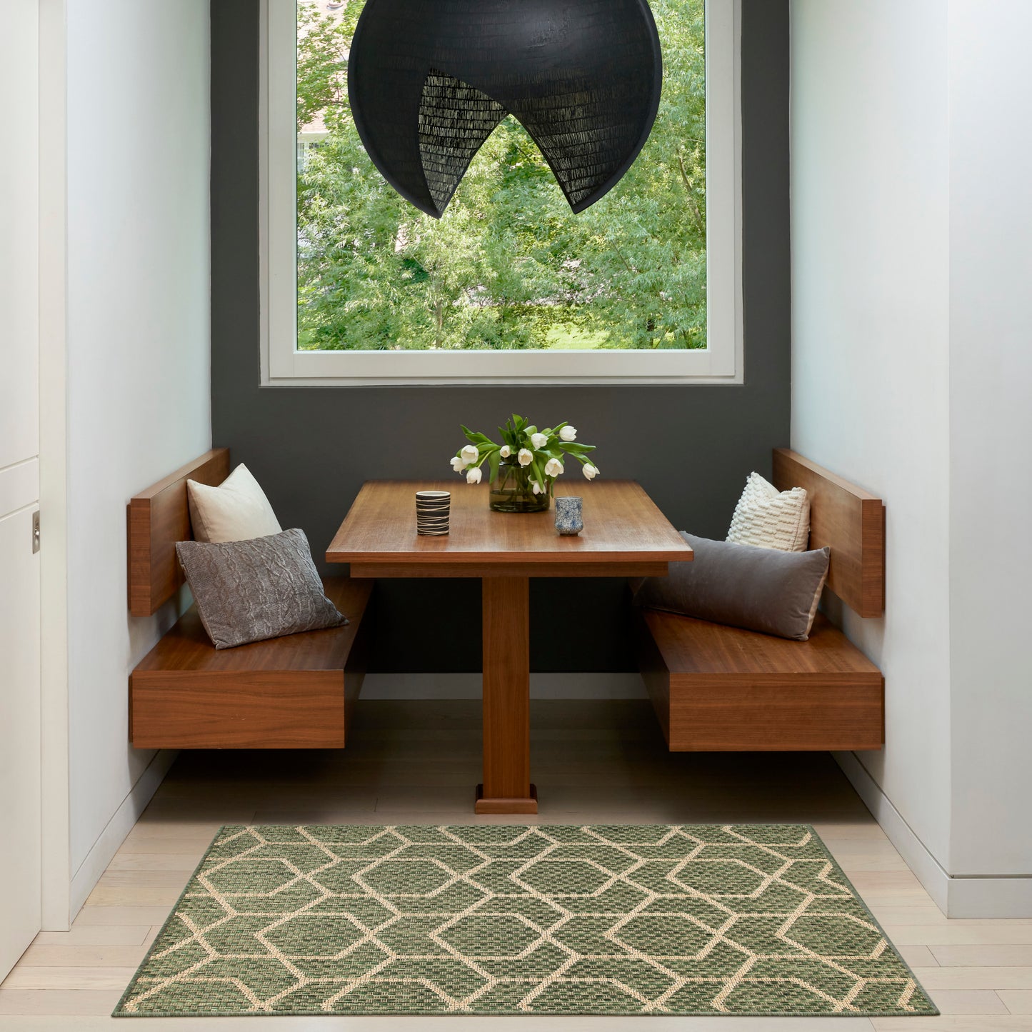 Geometric green rug (3' x 5') on the floor.