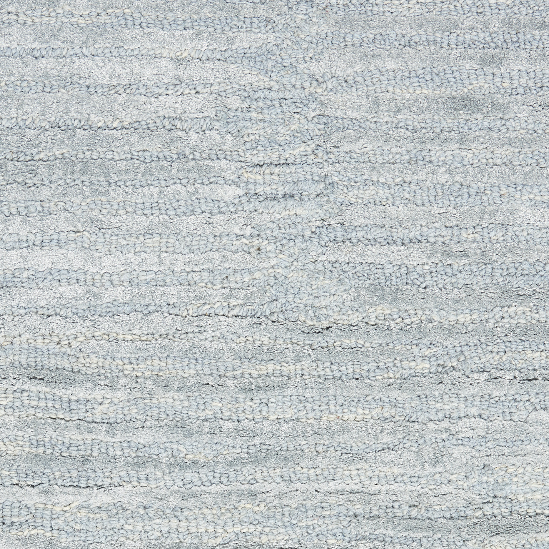 Light blue-gray terry cotton towel texture with looped fibers; soft bath towel.