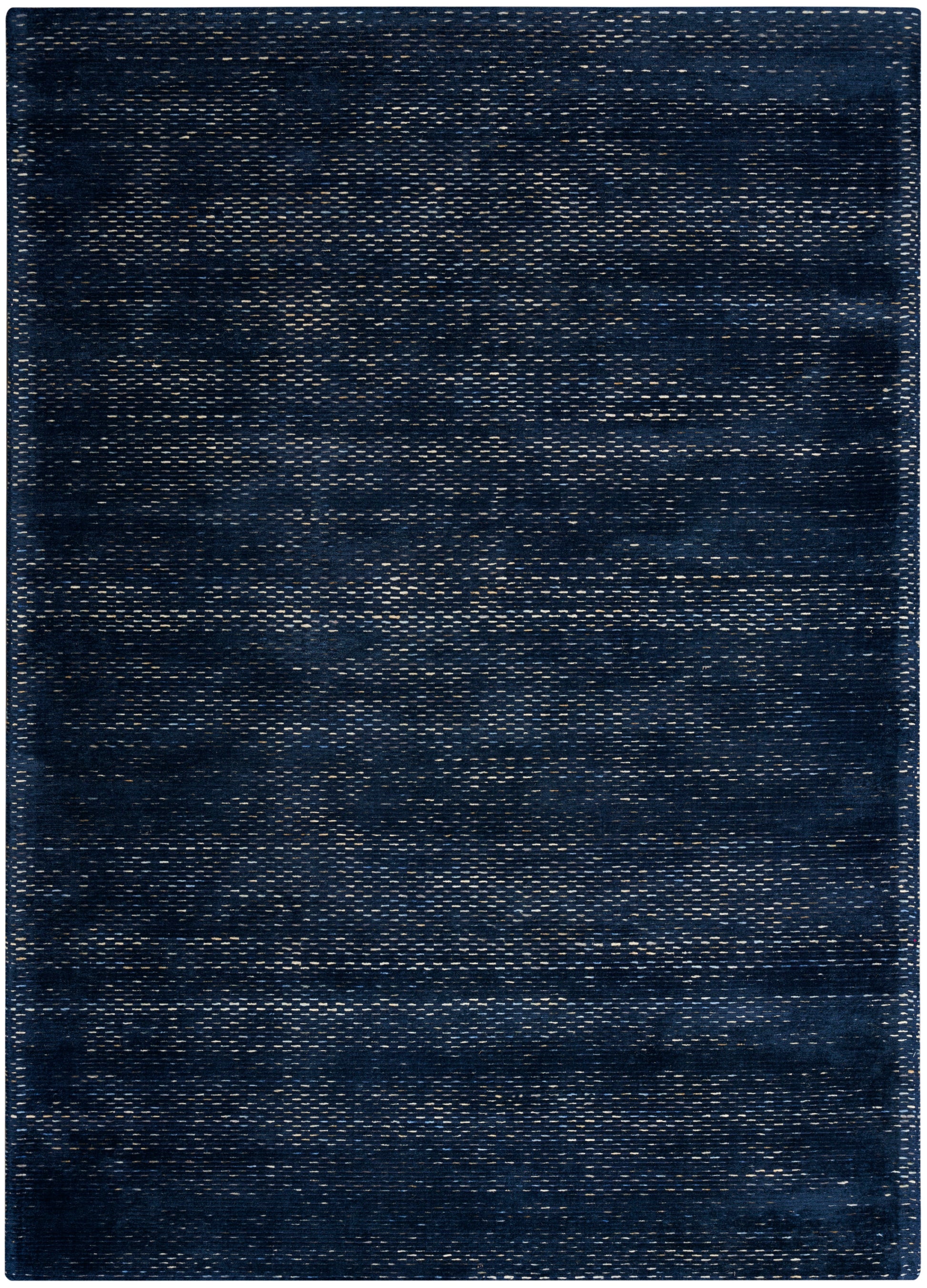 Rectangular dark indigo woven rug with denim-like texture and subtle lighter streaks for casual modern decor.