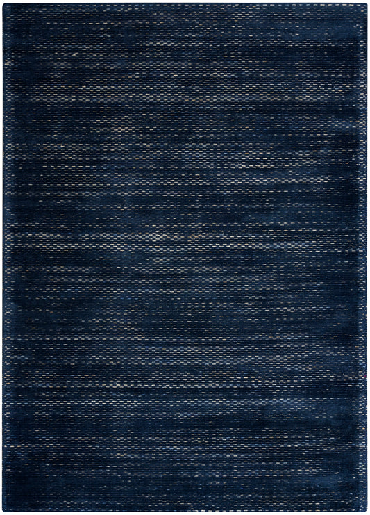 Rectangular dark indigo woven rug with denim-like texture and subtle lighter streaks for casual modern decor.
