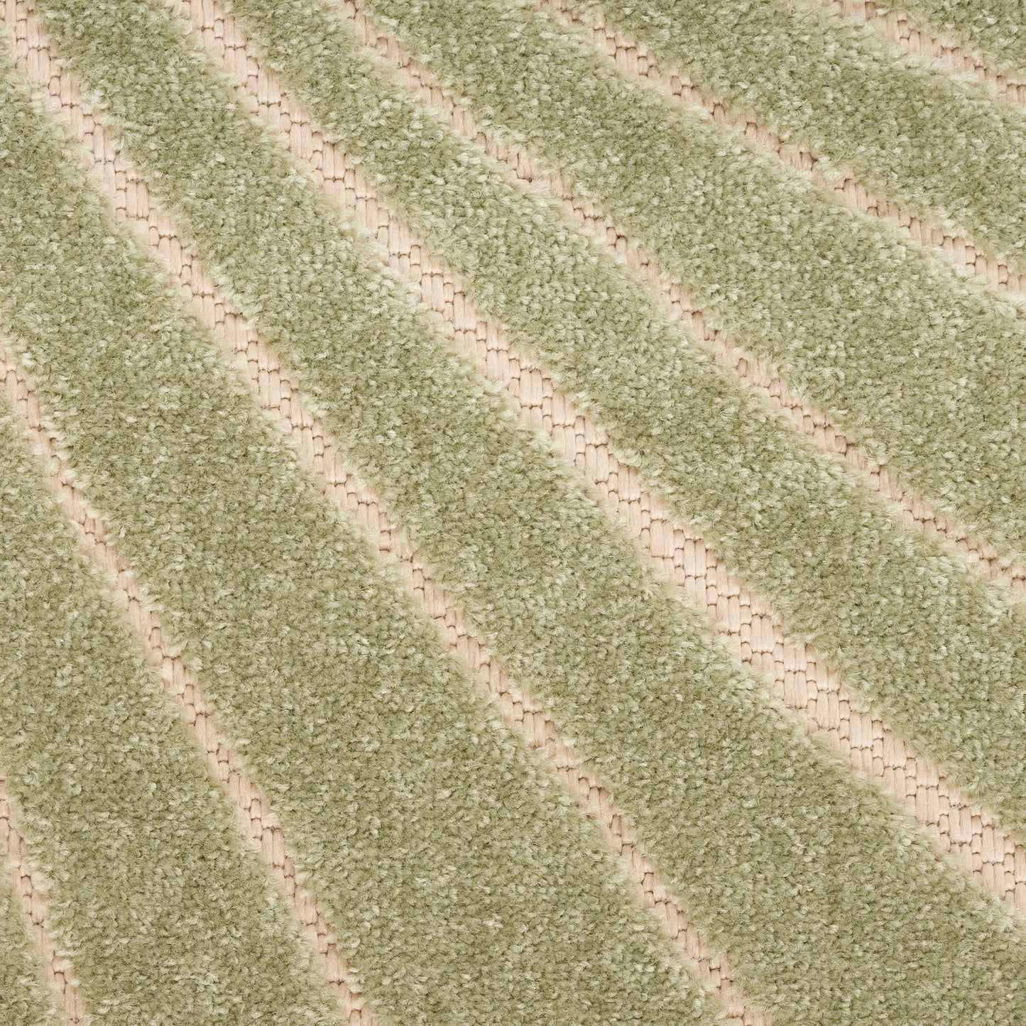 Close-up of sage green striped rug with soft loop pile and beige bands.