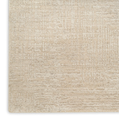 Beige textured rectangular area rug with subtle linear weave; soft neutral flooring accent.