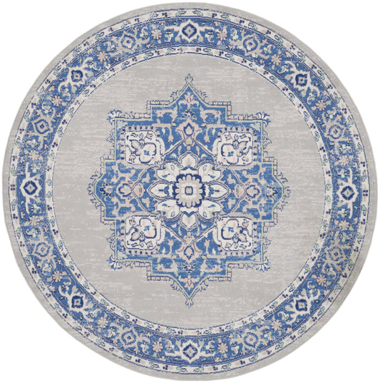 Round rug in blue and ivory-gray with ornate central medallion and floral border, Persian-inspired design.