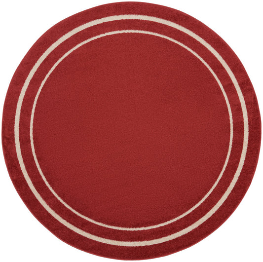 Round red area rug with two cream rings near the edge; soft plush texture.