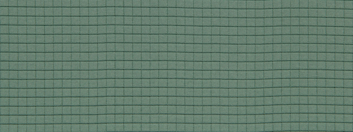 Close-up of green fabric with a fine dark teal grid pattern and subtle woven texture