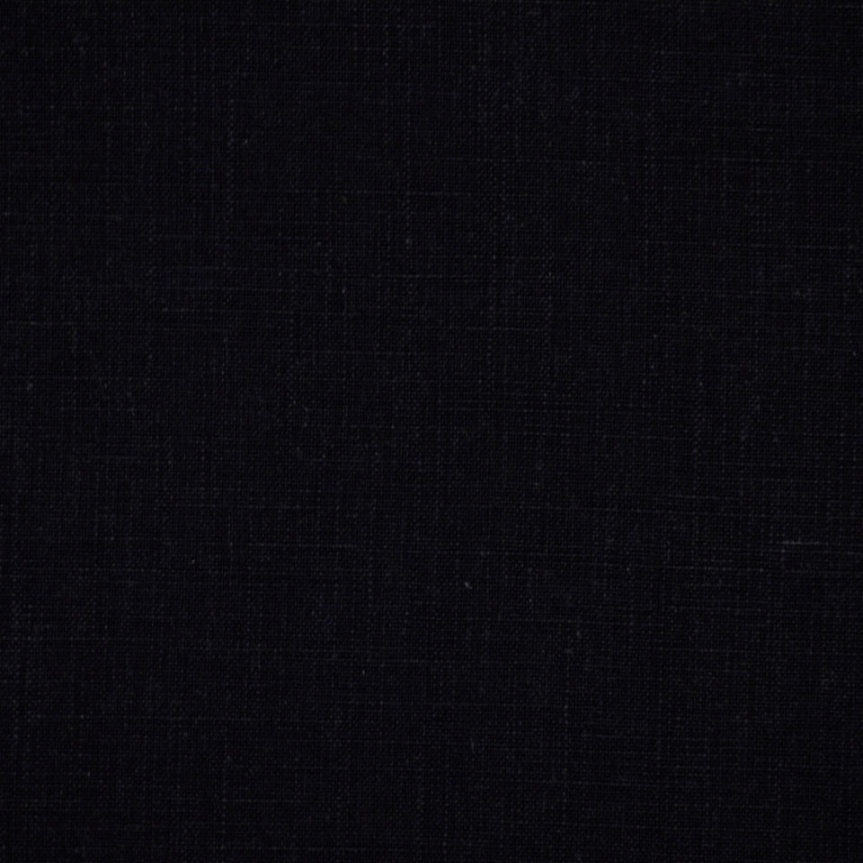 Close-up of black textile fabric with subtle woven texture.
