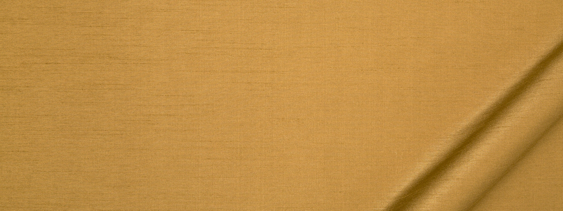 Golden mustard fabric with visible weave texture and a diagonal fold on the lower-right.