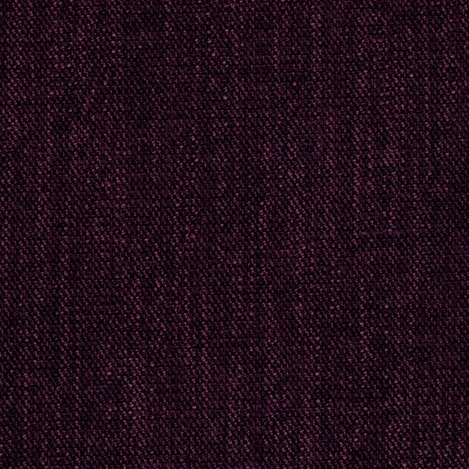 Close-up of eggplant-colored woven upholstery fabric with rich texture.