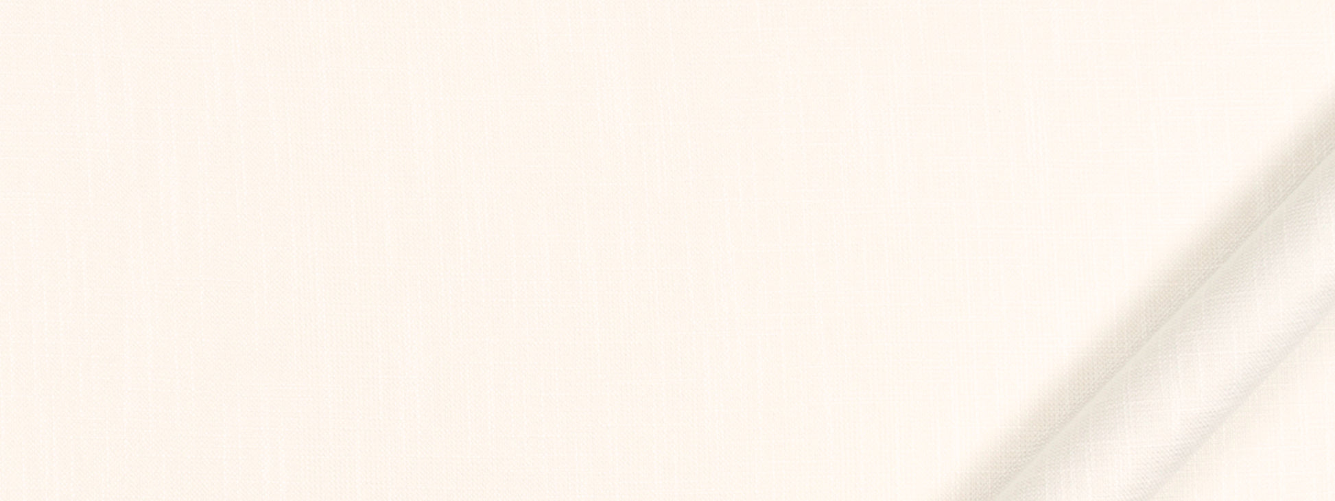 White linen-like fabric close-up with a subtle diagonal fold at the right, soft texture for upholstery or drapery.