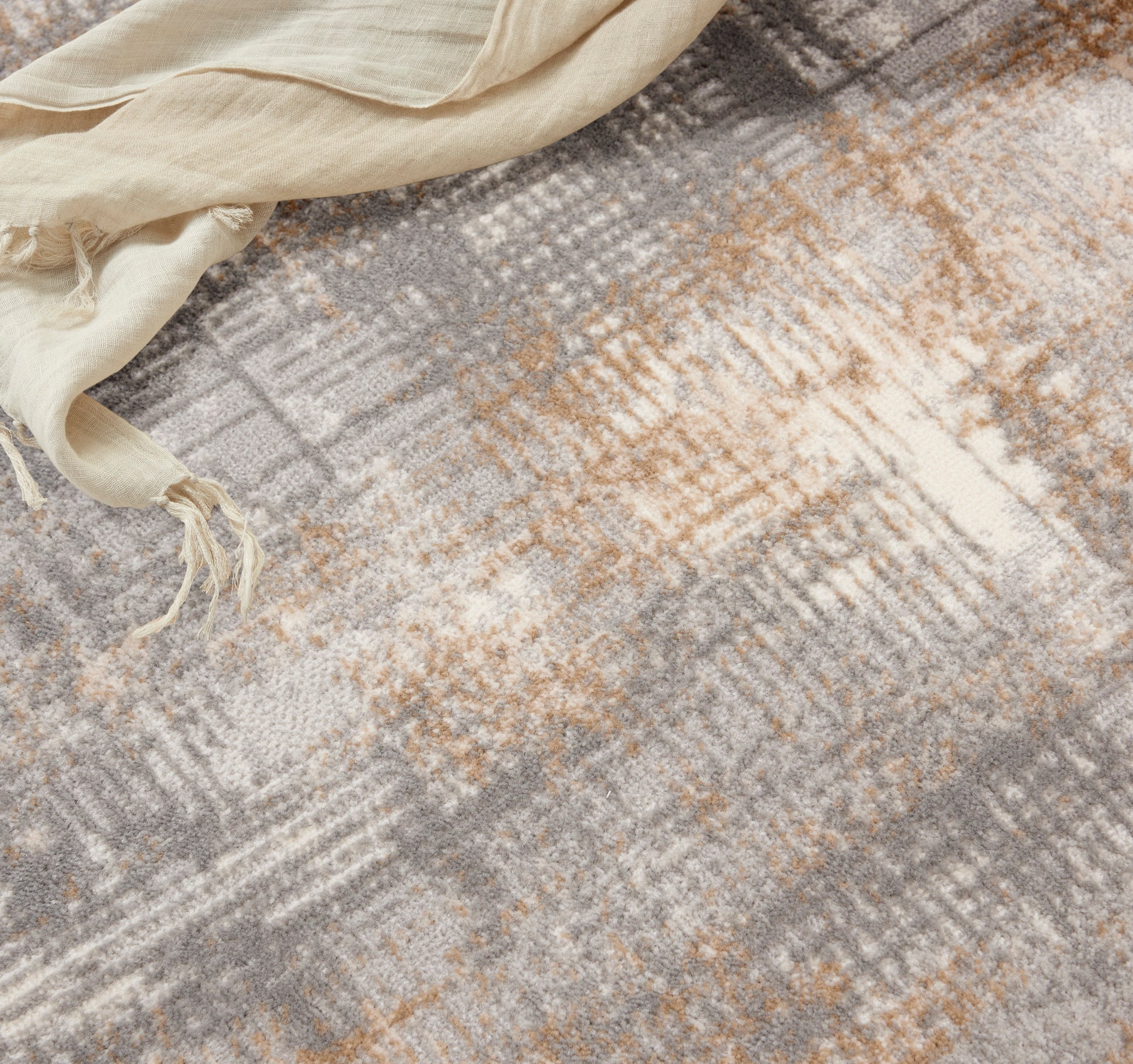 Abstract gray, beige and tan woven rug.