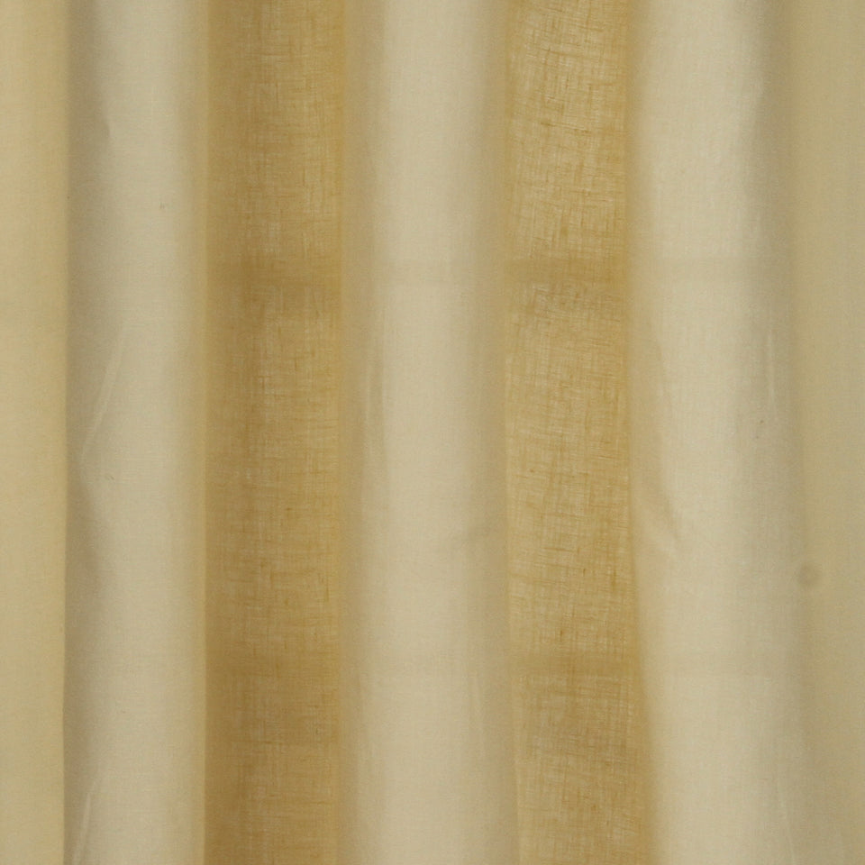 Beige and cream striped sheer curtains with a linen-like texture and vertical panels, diffusing soft daylight through the window.