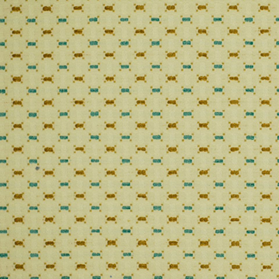 Beige upholstery fabric with a repeating grid of small brown and turquoise bow-tie motifs.