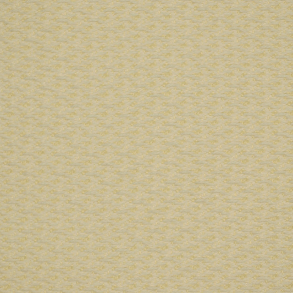 Soft pale yellow boucle fabric close-up with tiny speckled pattern, cozy upholstery & drapery material.