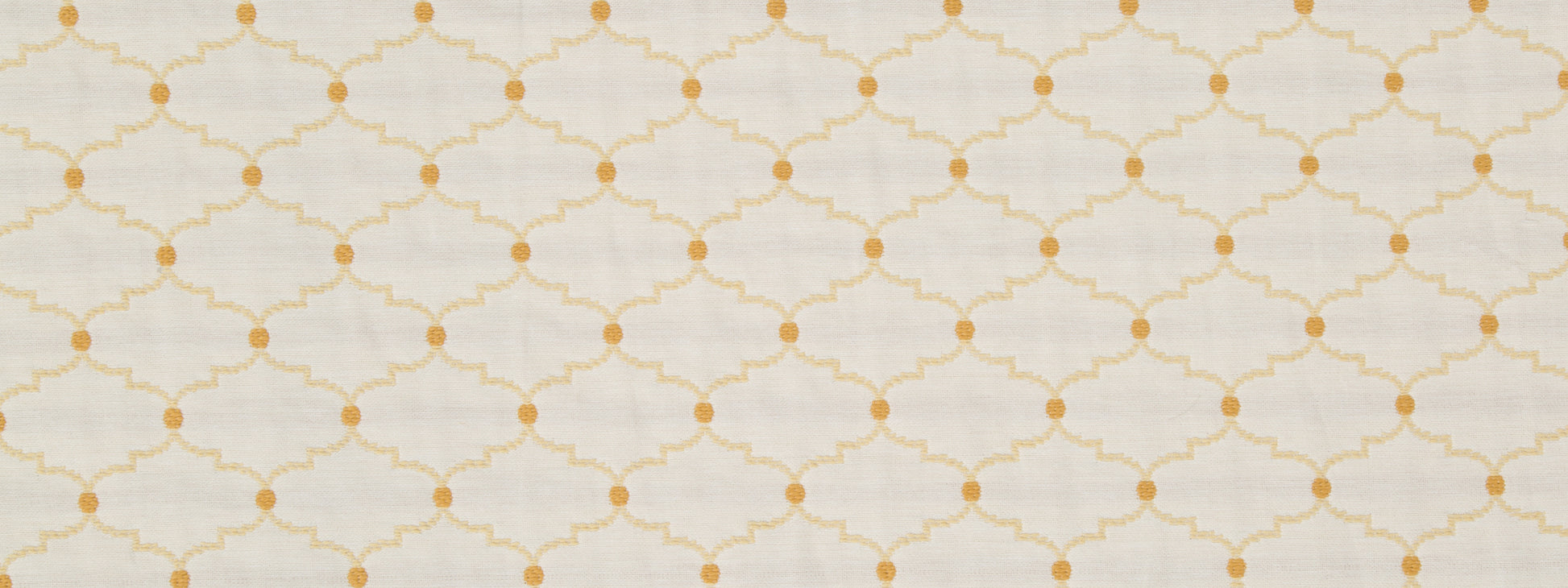 Cream background with pale gold lattice trellis pattern and small gold dots at intersections.