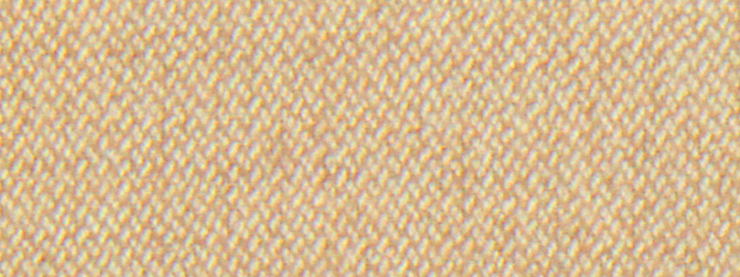 Close-up of sand-colored wool flannel fabric with diagonal twill texture and cream threads; warm textile swatch.