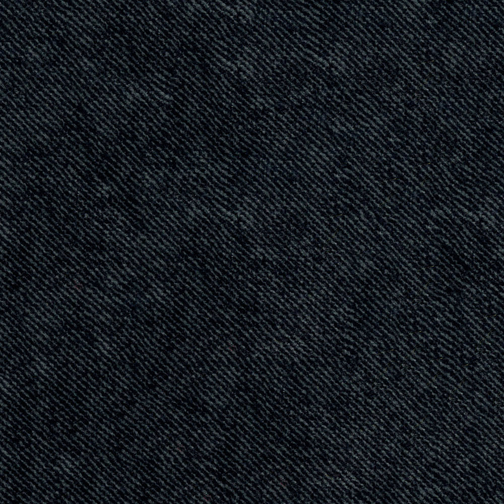 Close-up of dark indigo denim fabric with visible diagonal weave, casual sturdy material.