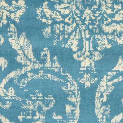 Blue damask fabric with cream floral pattern; versatile upholstery or curtain material.