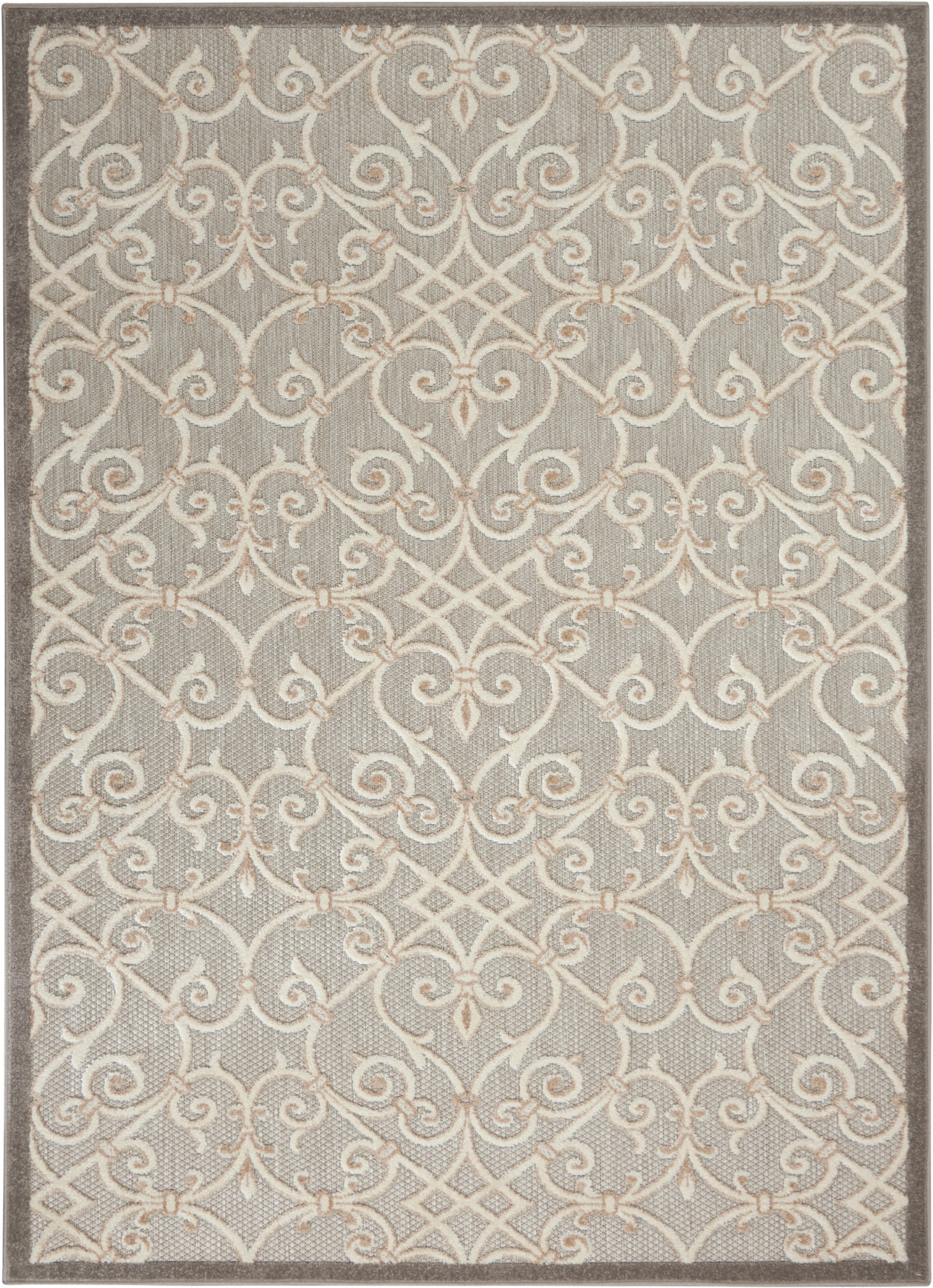 Gray rug featuring a cream scrolling lattice pattern with beige accents and a dark brown edge.
