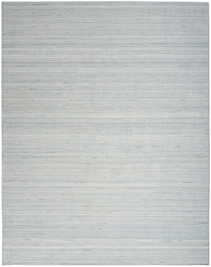 Light blue-gray flatwoven rug with subtle horizontal stripes and soft gradient.