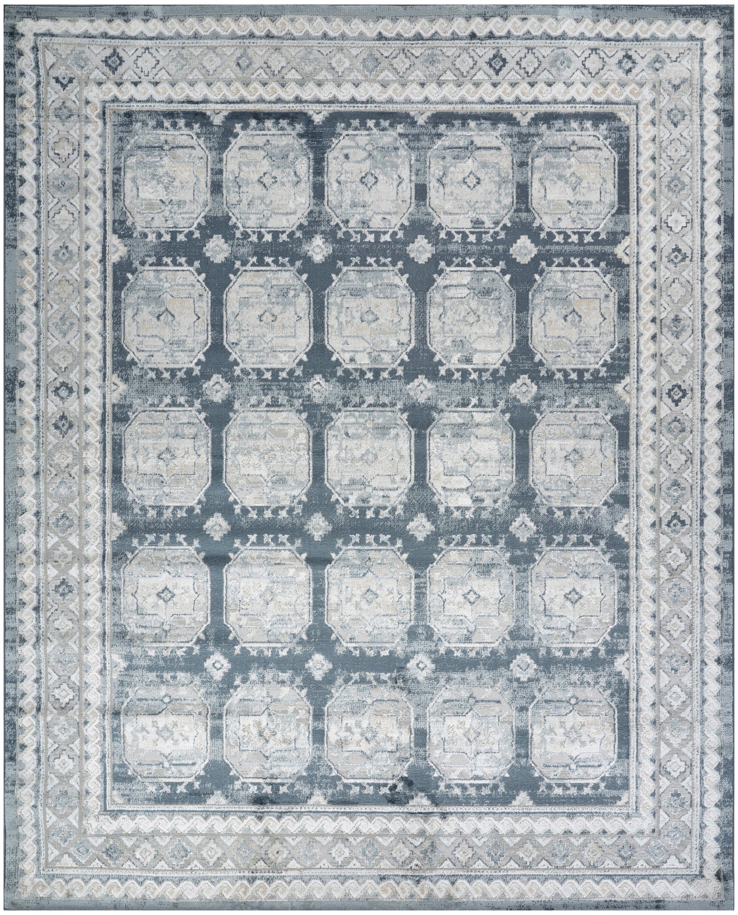 Blue-gray distressed area rug with a grid of pale octagonal medallions and ornate borders.