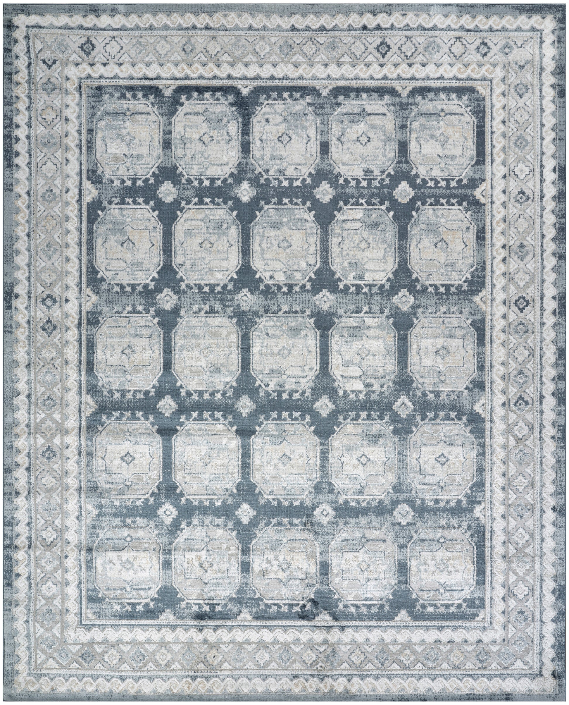 Blue-gray distressed area rug with a grid of pale octagonal medallions and ornate borders.